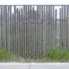 The old industrial wood fence slat installed many years ago.